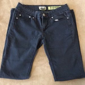 Dark blue jeans, red stitching